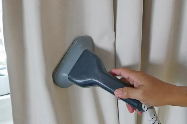 a-hand-of-a-man-holding-on-a-garment-steam-head-wh-2026-01-06-10-24-35-utc