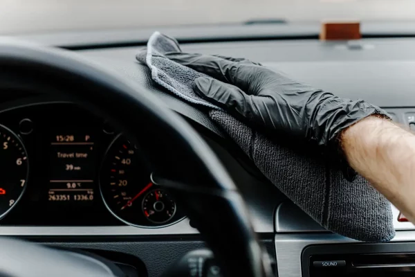 man-s-hand-in-black-glove-cleaning-car-interior-d-2026-01-08-05-02-52-utc