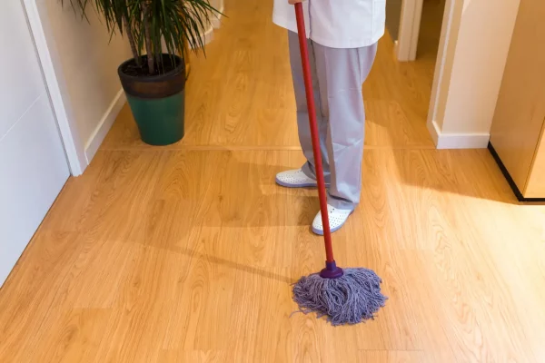person-mopping-the-wooden-floor-indoors-2026-03-17-07-11-41-utc