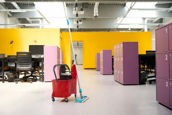 red-cleaner-cart-with-work-gadgets-stand-in-middle-2026-03-10-03-59-41-utc