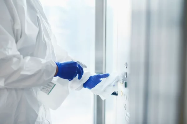 technician-disinfecting-buttons-of-the-elevator-2026-03-13-01-58-47-utc