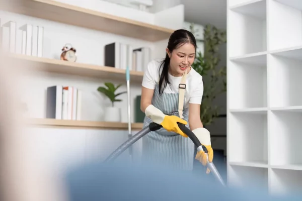 young-woman-happily-cleaning-in-bright-modern-home-2026-01-09-11-51-16-utc